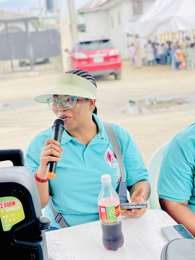 A facilitator speaking to participants with a microphone