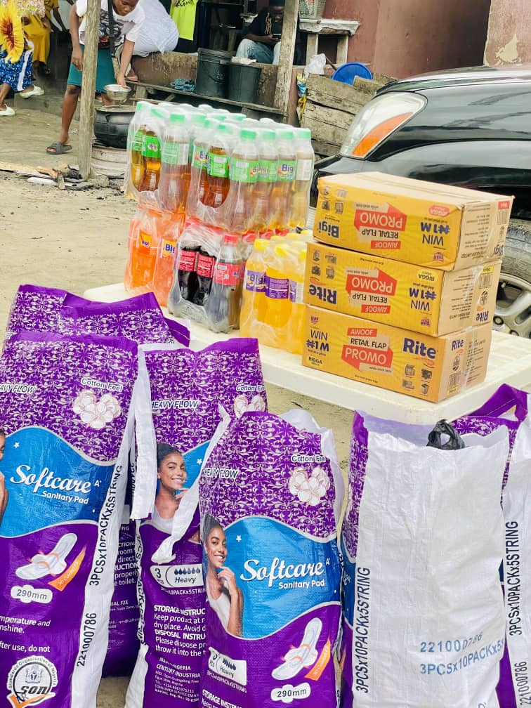 Sanitary pads, drinks and food cartons laid out ready for distribution