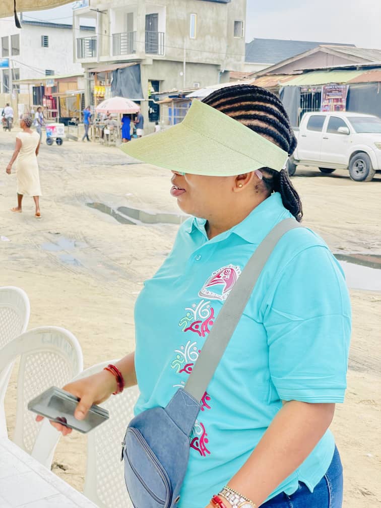 SSI volunteer in branded polo shirt during a community outreach